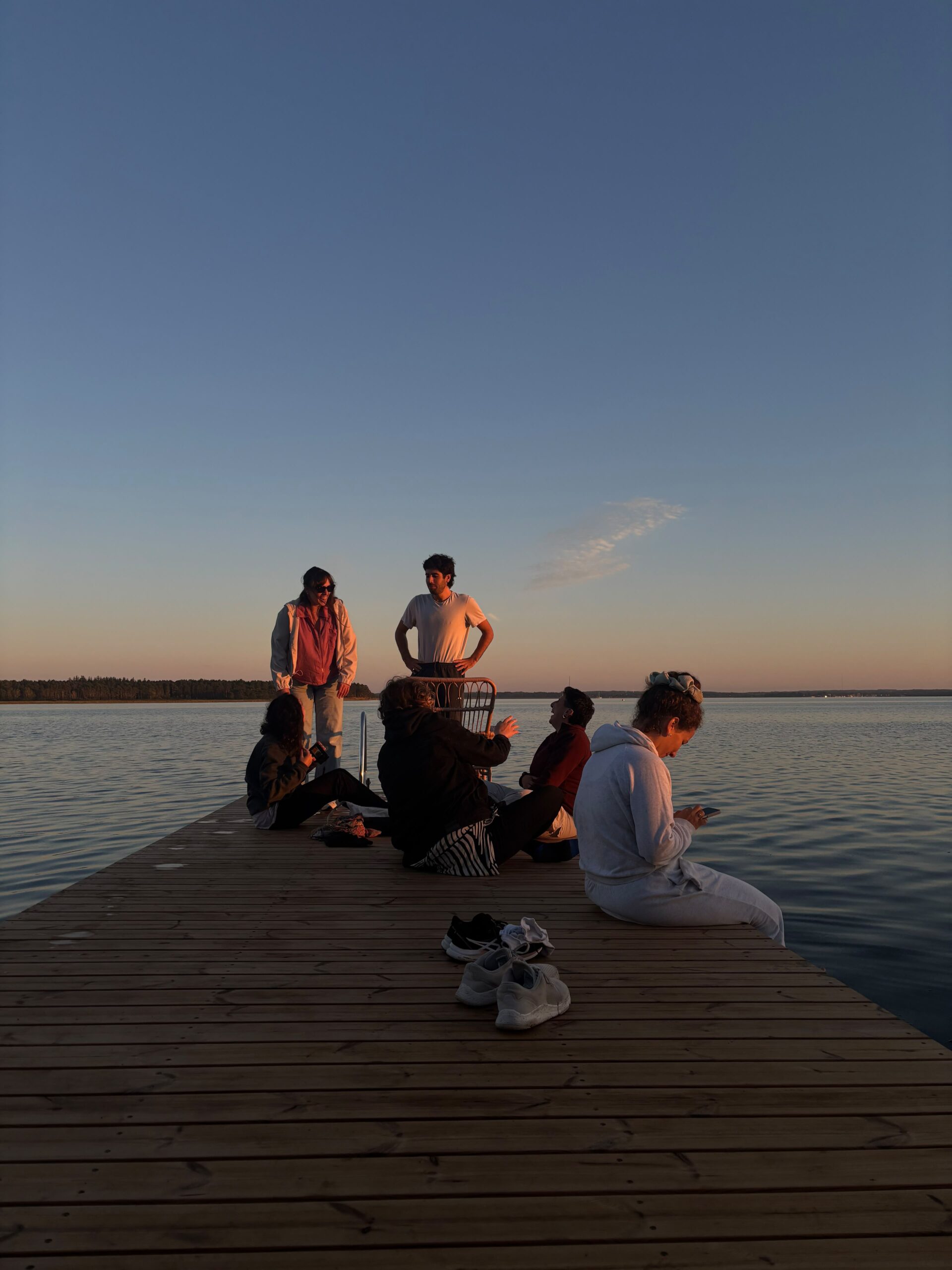 Volunteers enjoying paddleboards on calm water near Lindersvold